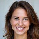 Portrait of Sarah J., a smiling woman with a healthy and vibrant appearance, looking confident.